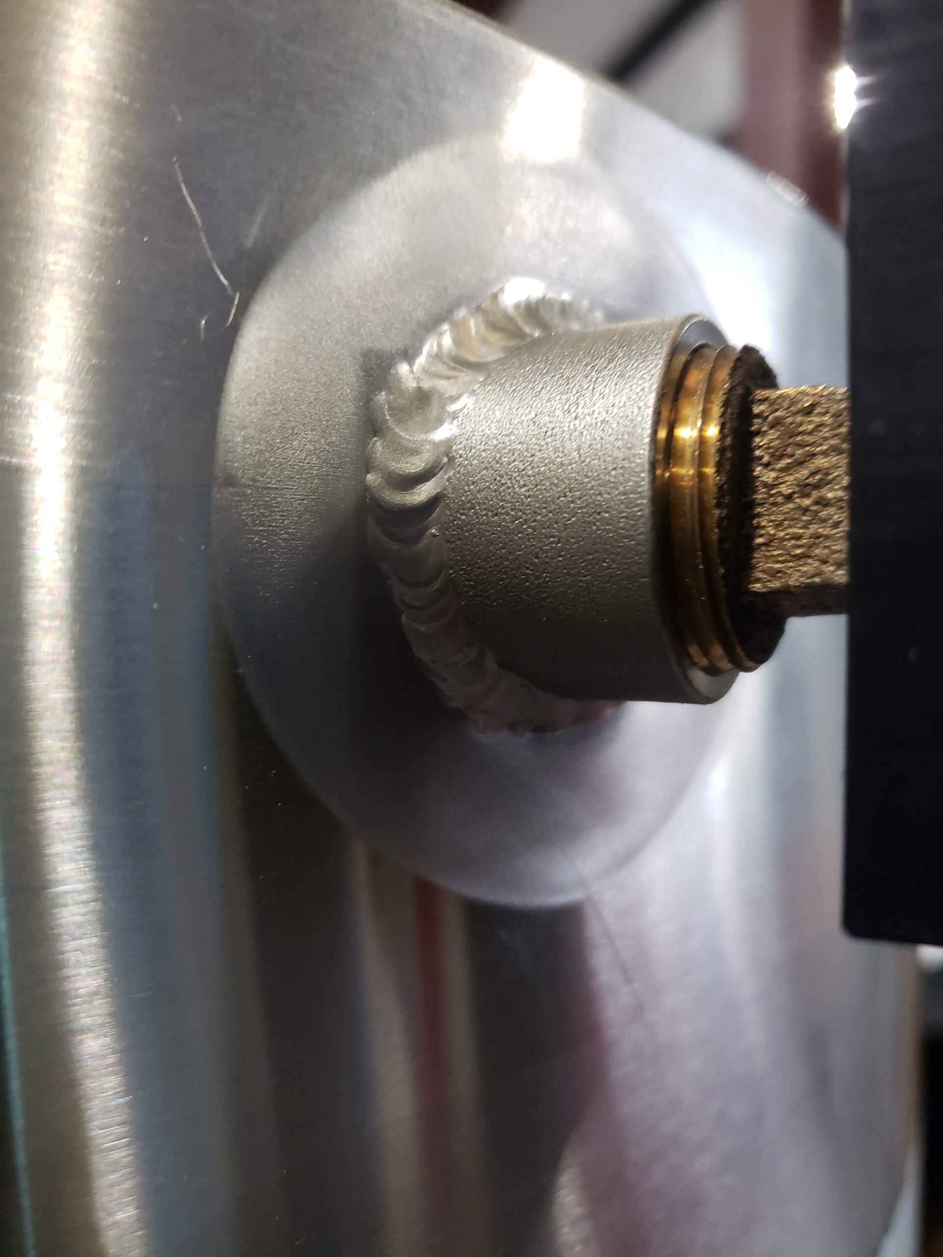 Coupling on stainless tank